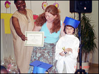 A young girl receives an award.